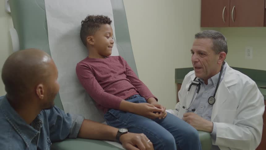 A footage of a doctor attending to a boy