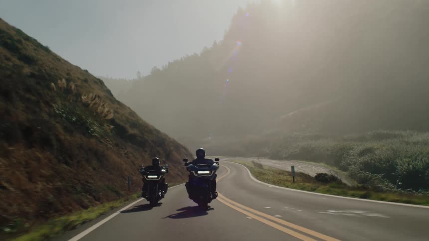 A footage of a bike moving on the tarred road
