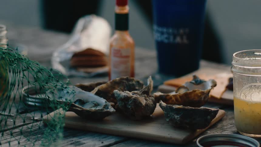 Oysters and sauces are on the table outside