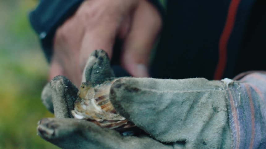 Man working some burned material
