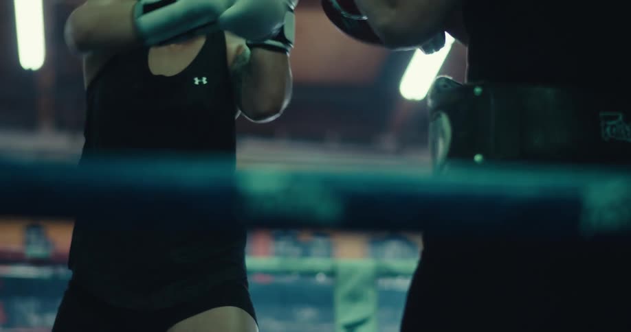 A woman is boxing in the ring