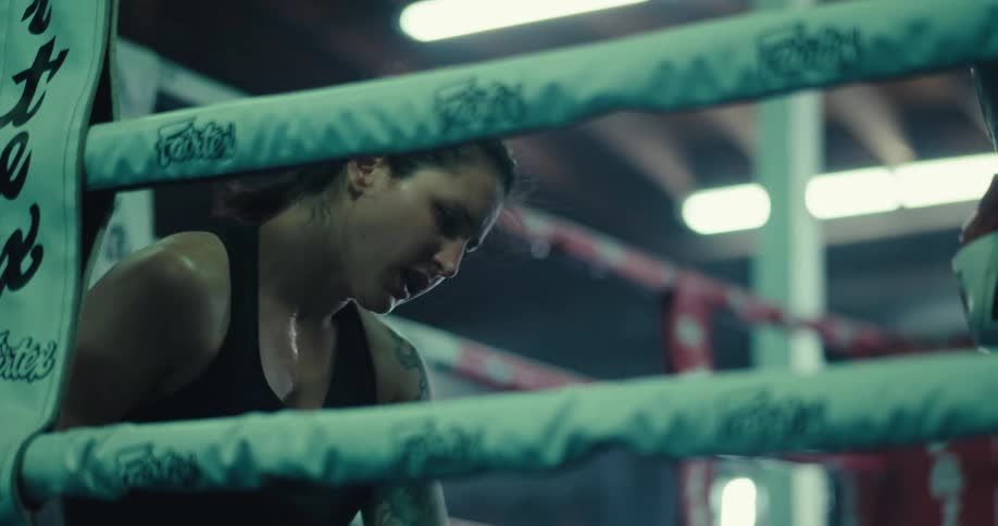 A boxer falls to the ring floor in frustration during a practice session