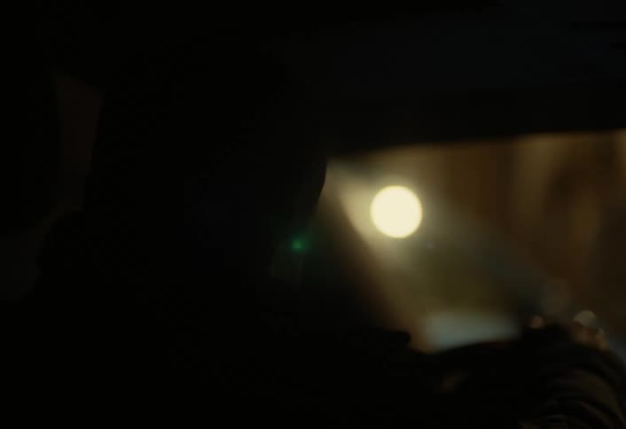 A man driving a car at night