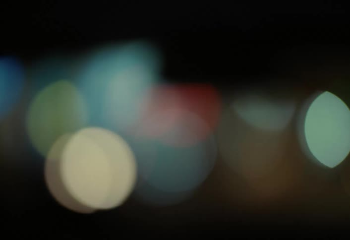 The traffic passing is out of focus at night