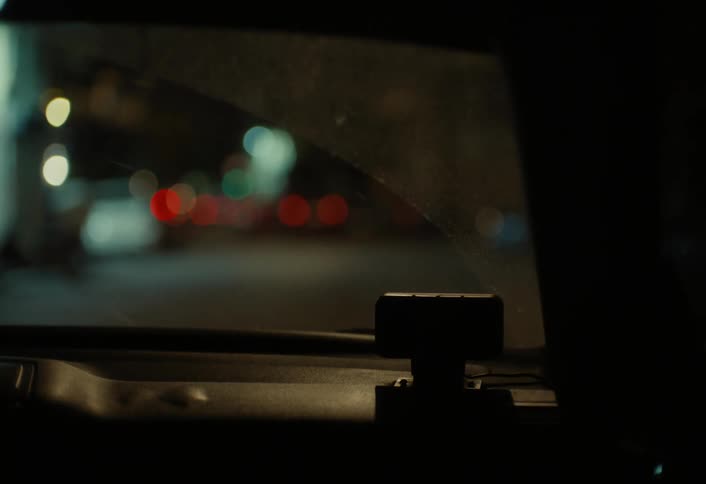 A dash cam is in the moving car