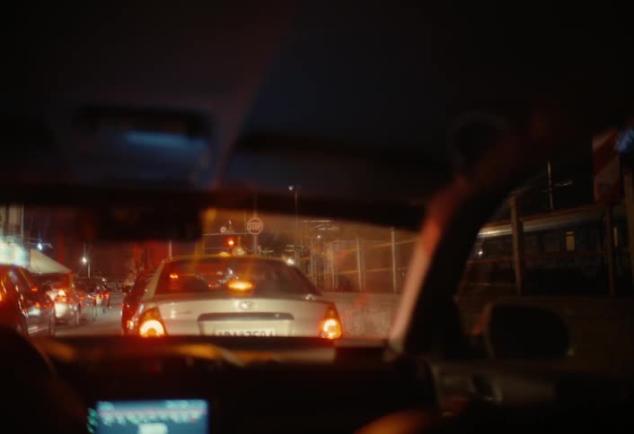 A footage of a person in a car inside the traffic