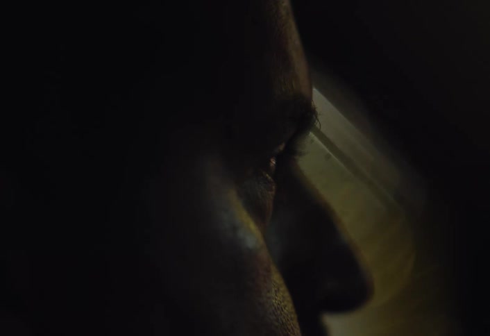 A man is driving at night