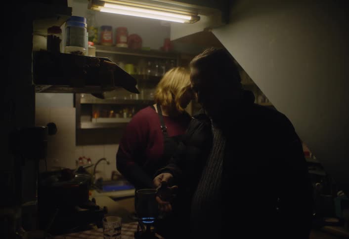 A footage of a man and a woman cooking in the kitchen
