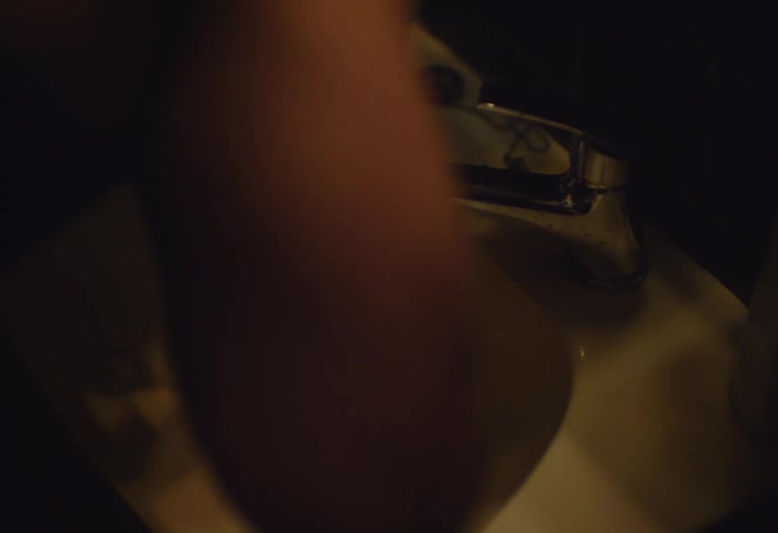 Person rinses using water from the bathroom sink