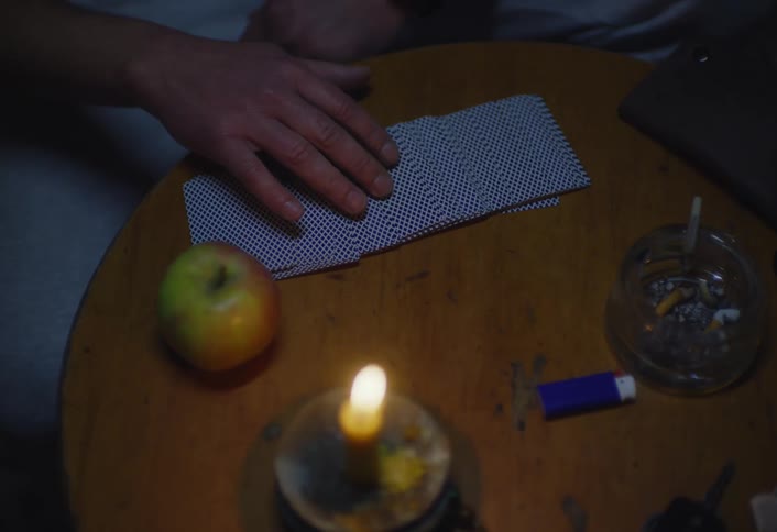A footage of a person playing card game