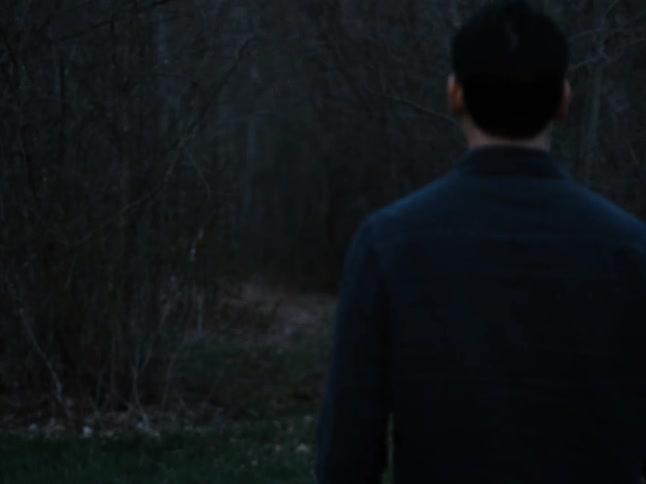 A man hikes into the forest