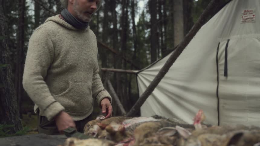 A footage of a man goin into the tent