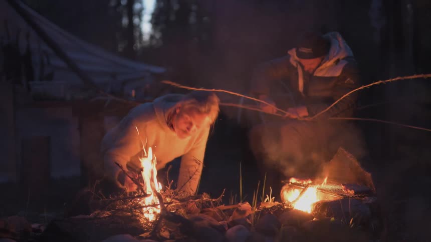 A footage of a person making a camp fire