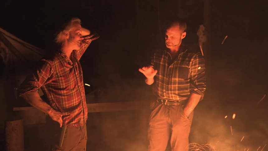 A footage of men discussing outdoor