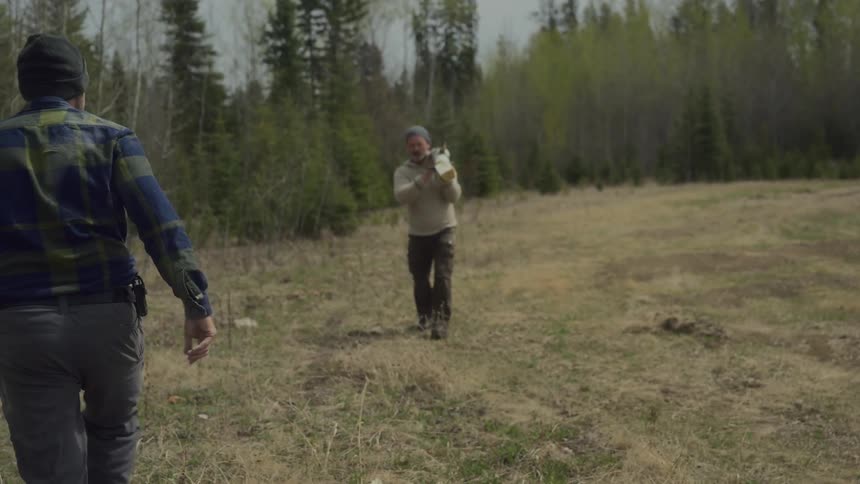 A footage of a man lifting a wood
