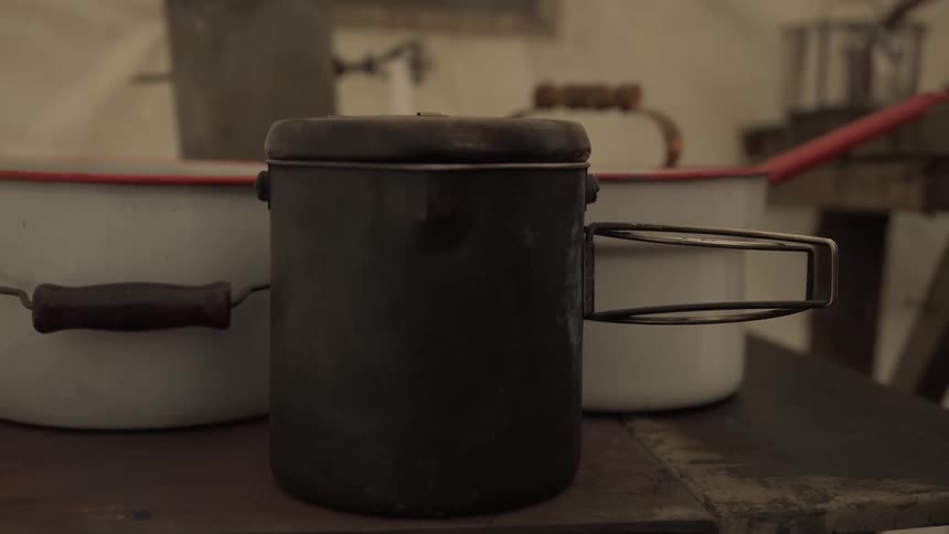 A person puts the pot down
