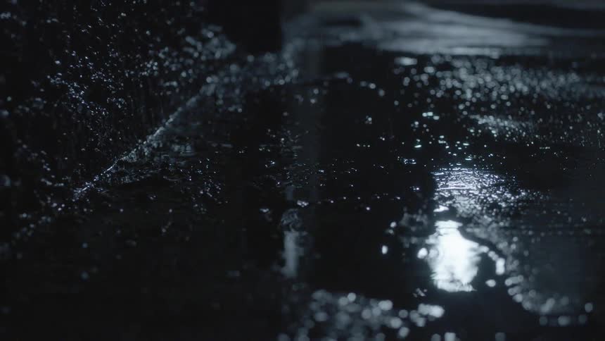 The rain is filling the puddles on the ground