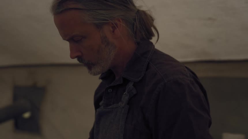 A footage of a man in a tent