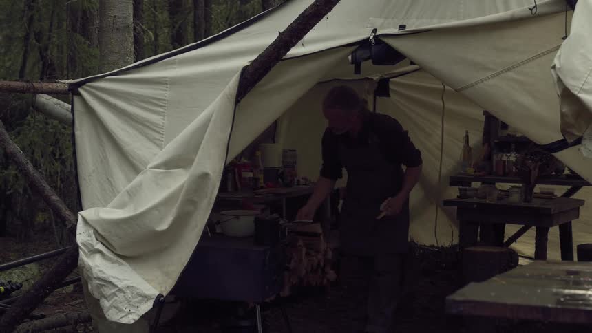 A footage of a man camping in the woods