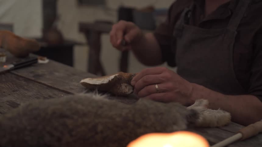 A footage of a man sharpening a knife