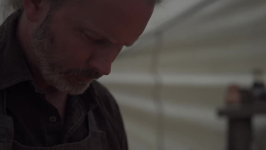 A footage of a man in a tent