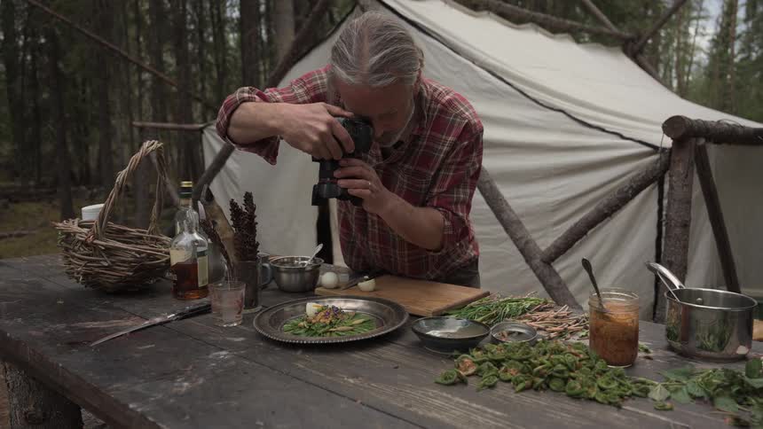 A footage of a man taking pictures