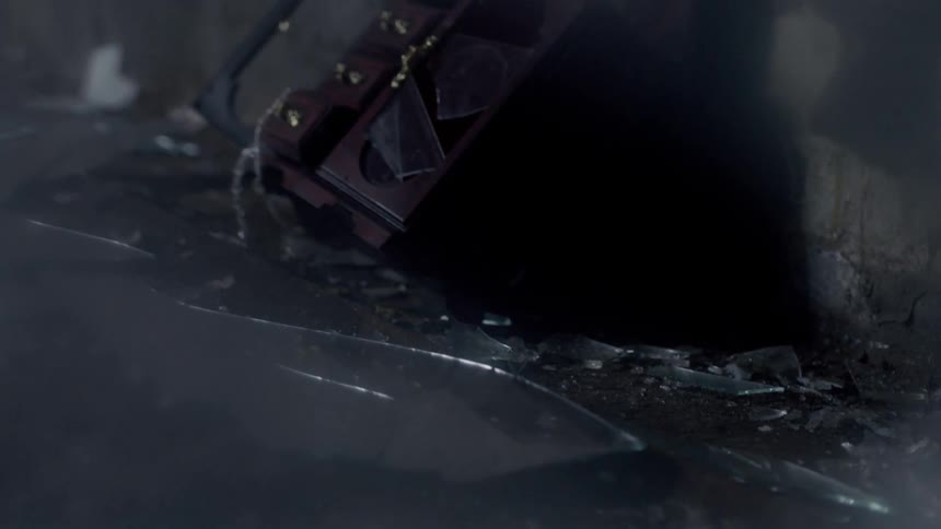 Shards of glass cover the ground