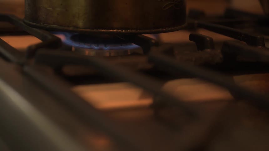 A pot of food is being cooked on top of a stove