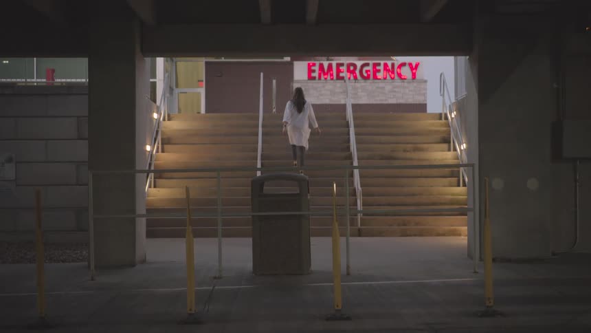 A footage of a lady claiming a staircase