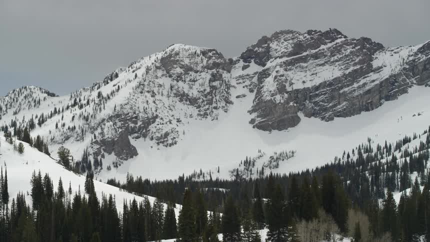 A view of mountains covered in snow