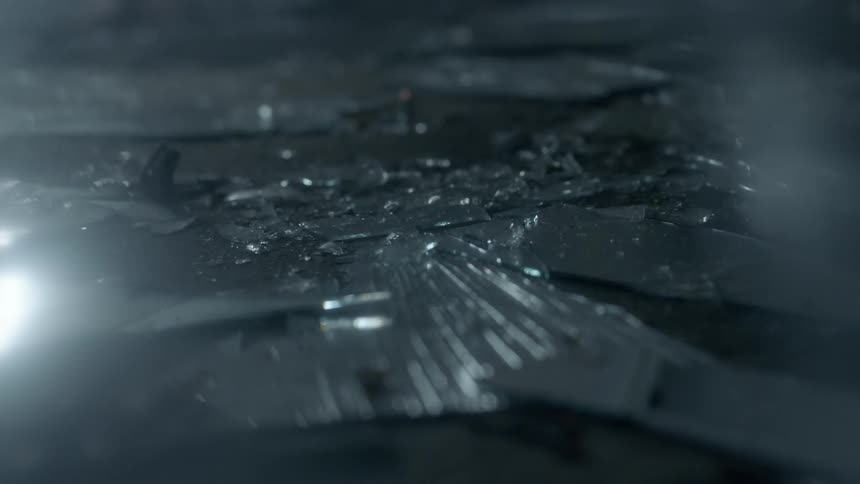 Light glaring off glass on the ground
