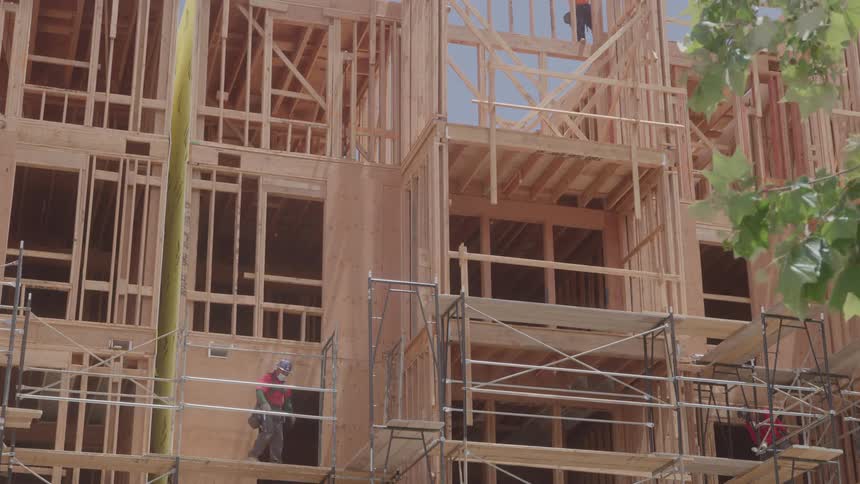 A footage of workers at a building construction