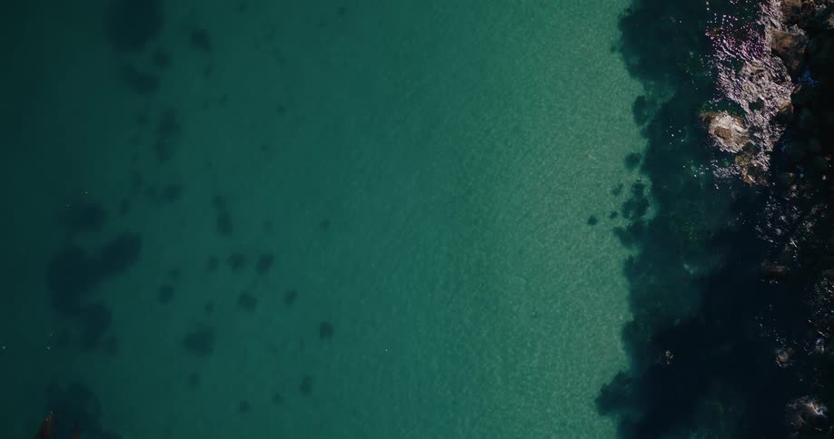 Sunlight is shining on the calm ocean water