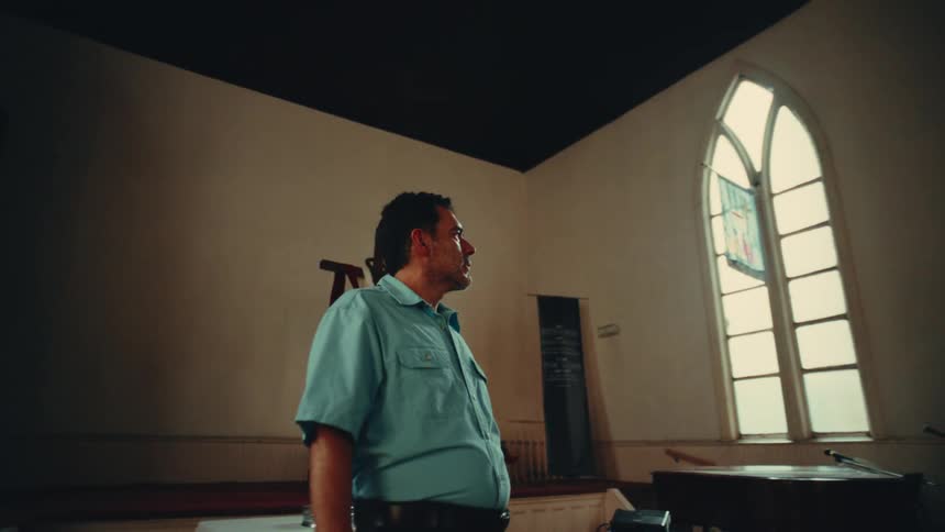 A footage of a man walking indoor