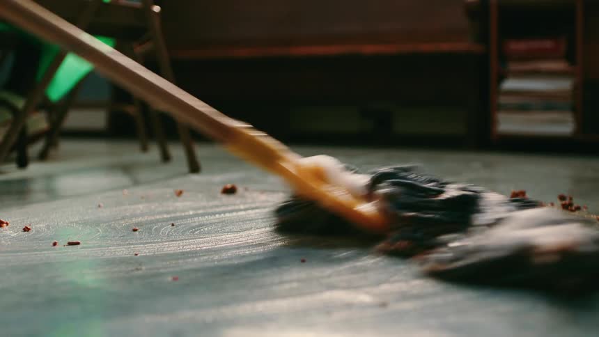A mop mops up a spill on the kitchen floor