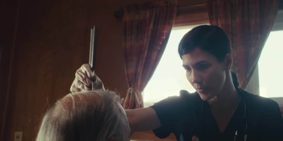 A doctor is examining a man at home