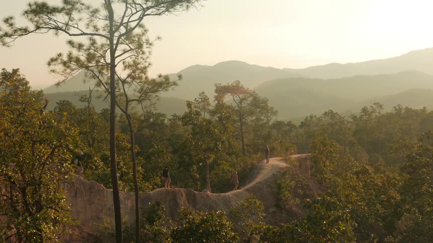 People walk across a rock path