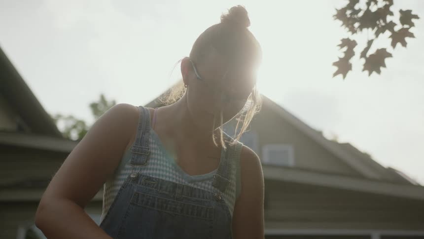 A teenager is looking down at something