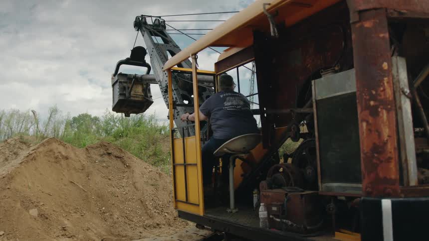 A footage of a person driving a tractor