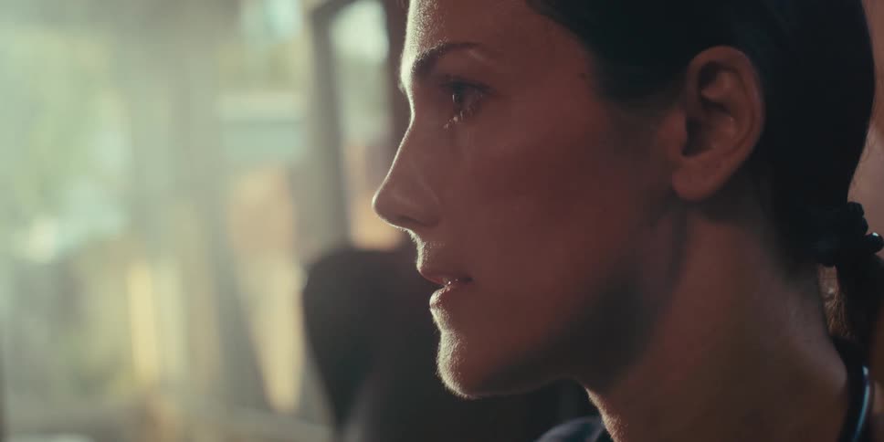 A footage of a lady having a conversation indoor