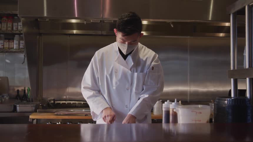 A footage of a person cooking in the kitchen