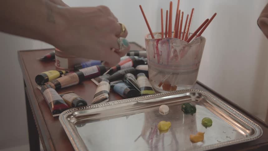 A footage of people putting paints on train