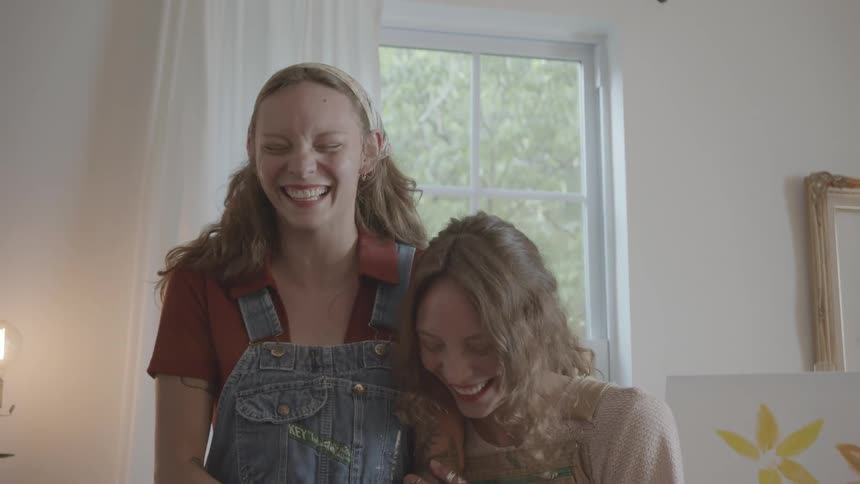 Two friends are laughing and having fun together
