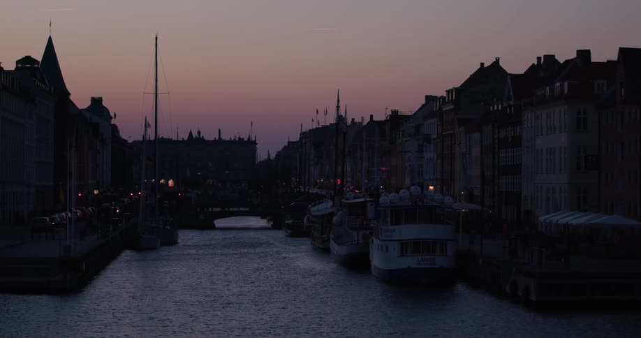 A landscape view of a canal at dusk