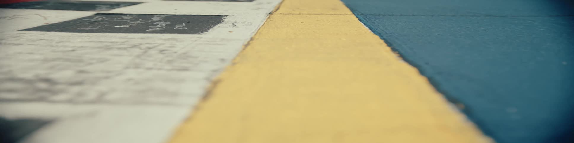 Panning along a floor with tiles and stripes