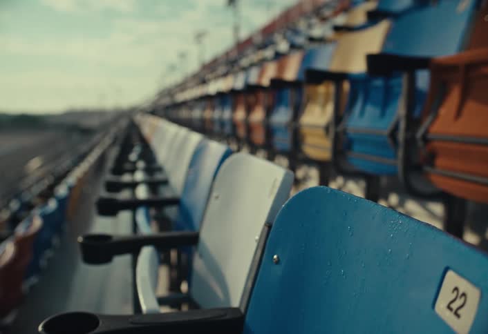 Empty rows of stadium chairs