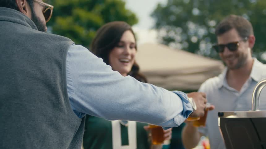 A footage of people sharing a drink