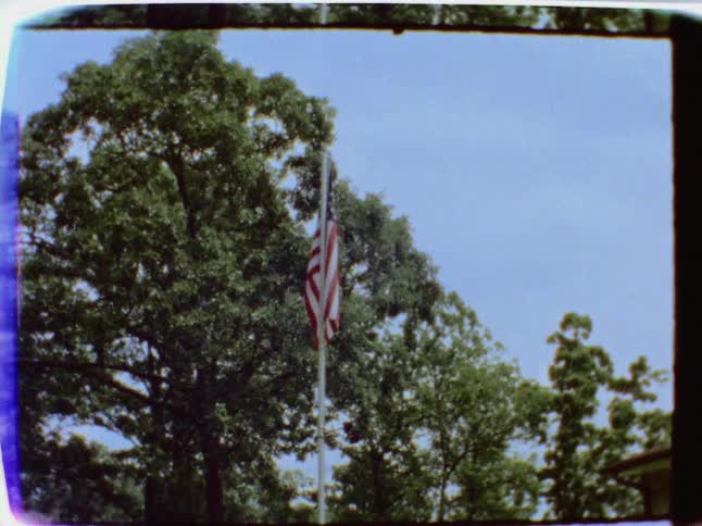 An american flag hangs from a flagpole