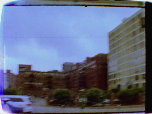 City buildings are shown on a cloudy day