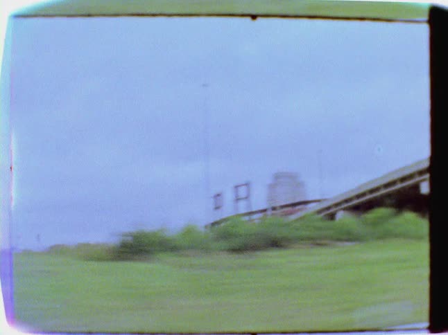 Highway bridge seen from a moving vehicle window